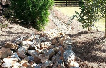 dry creek bed installed by Pannone’s Lawn Pros & Landscaping