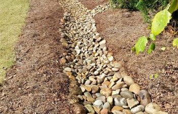 dry creek bed installed by Pannone’s Lawn Pros & Landscaping