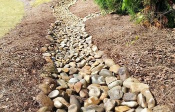 dry creek bed installed by Pannone’s Lawn Pros & Landscaping