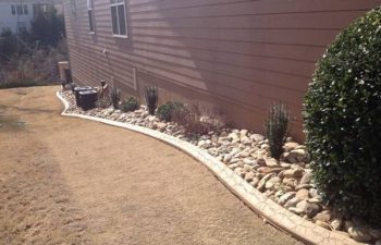 dry creek bed installed by Pannone’s Lawn Pros & Landscaping