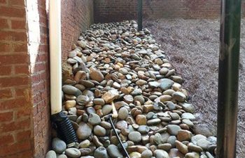 dry creek bed installed by Pannone’s Lawn Pros & Landscaping