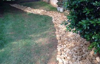 dry creek bed installed by Pannone’s Lawn Pros & Landscaping