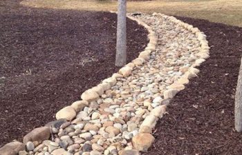 dry creek bed installed by Pannone’s Lawn Pros & Landscaping